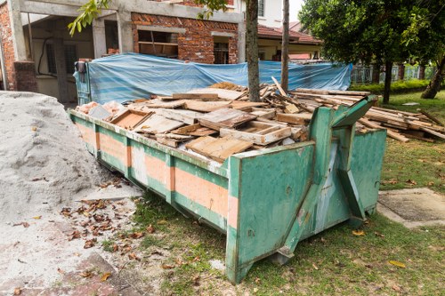 Professional using gardening tools for clearance